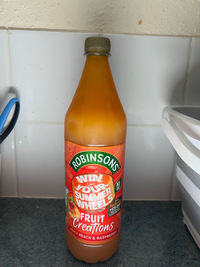 A bottle of Robinsons Peach and Raspberry squash.