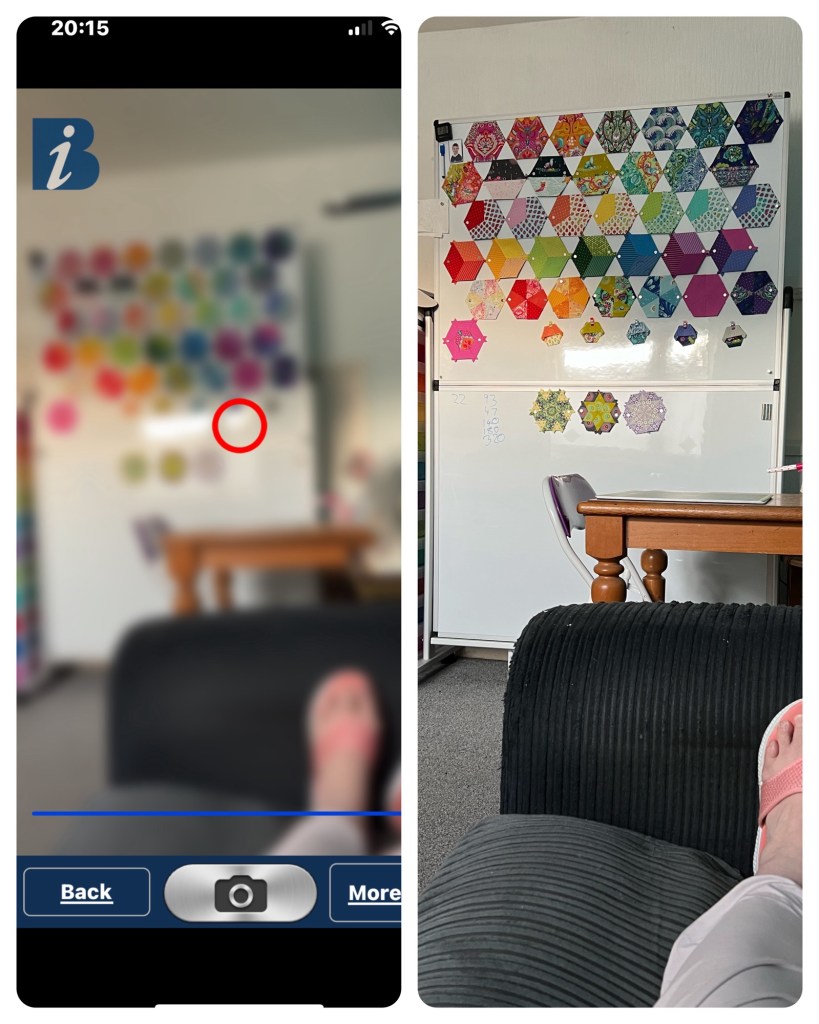 Photo collage of two similar scenes in a room.

On the left, a blurry screenshot that shows a person’s foot in sandals resting on a sofa, a wooden table, and in the background a whiteboard with colourful hexagon shapes arranged in a grid pattern. There is a large blue icon with a white “i” at the upper left and a red circle in the centre. The user interface at the bottom shows this is from an app that simulates sight conditions.

On the right, a sharply focused photo of the same scene. The foreground has a foot in a pink sandal on the same ribbed sofa. Towards the right is a sturdy wooden table. There is a large whiteboard displaying hexagonal English Paper Pieced quilt blocks arranged by in a honeycomb pattern, with some smaller hexagons underneath (parts for new blocks. Some handwritten numbers are visible on the lower whiteboard. The lighting is natural, and the room looks cosy and tidy.